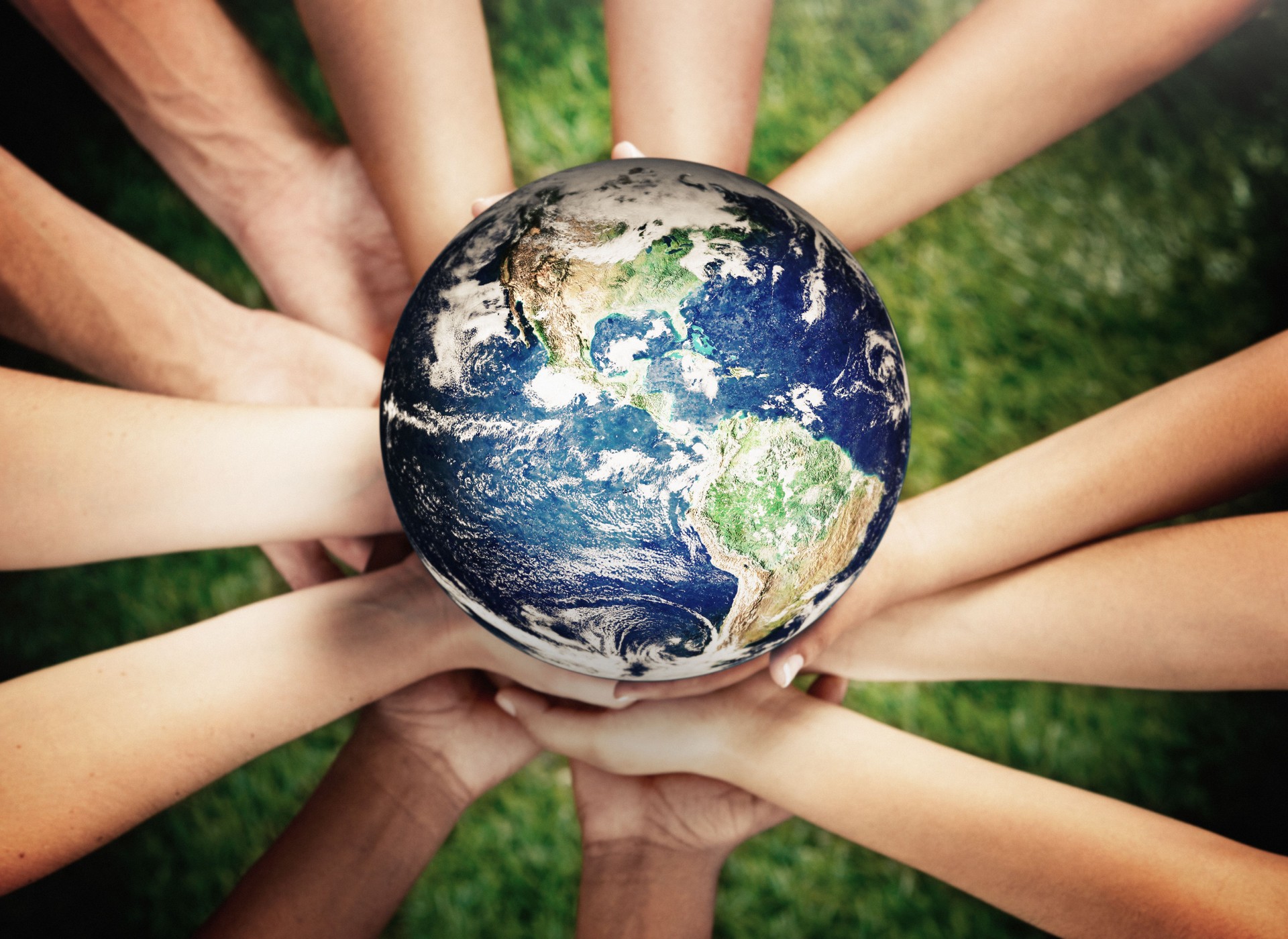 Group of caring young men and women supporting Planet Earth